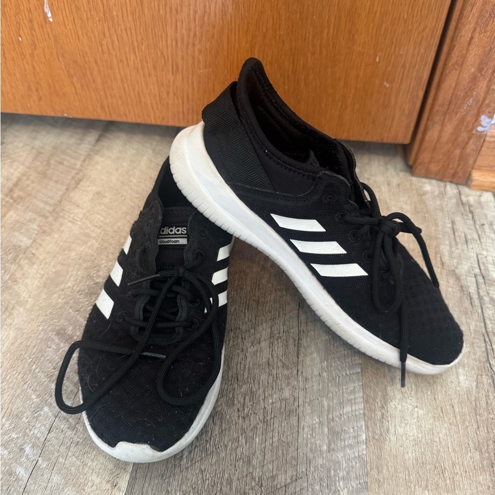 Adidas Cloud Foam size 6.5 black w white striped.  Upper good condition